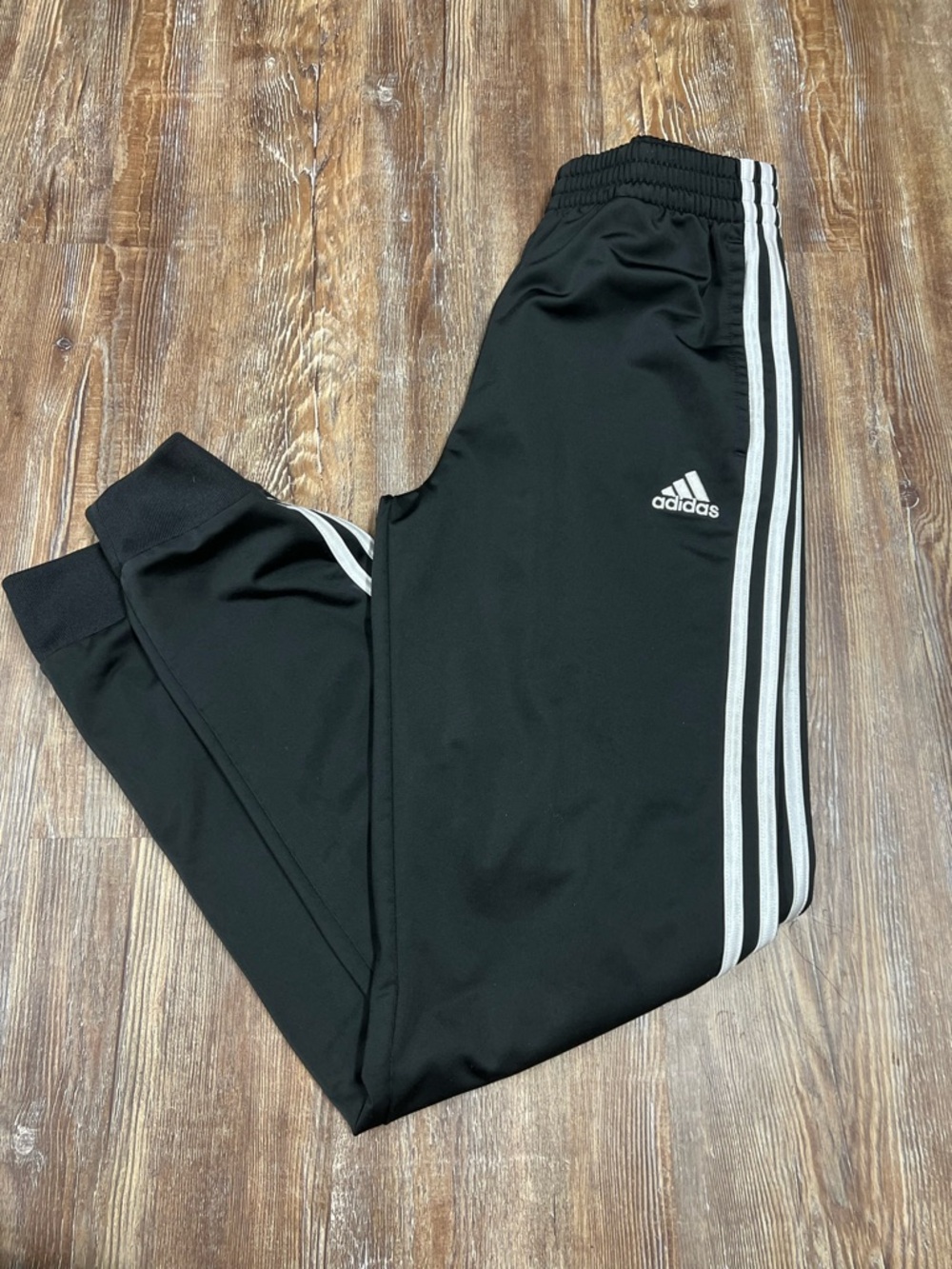 Adidas black track pants with white stripes kids large